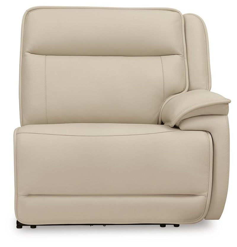 Ashley Furniture Double Deal reclining sectional with plush cushions and fabric upholstery, shown from a front head-on view.