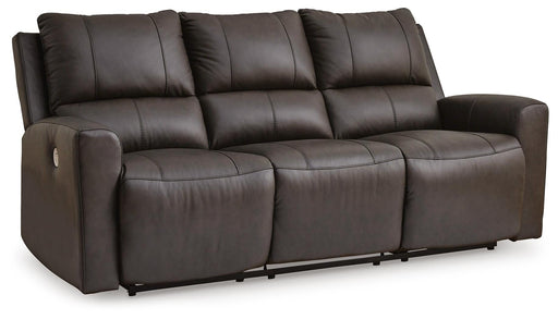Ashley Furniture Boxmere power reclining sofa with plush cushions and dark upholstery, shown from a side angle with reclined feature.