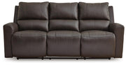 Ashley Furniture Boxmere power reclining sofa with plush cushions and dark upholstery, shown from a head-on view.