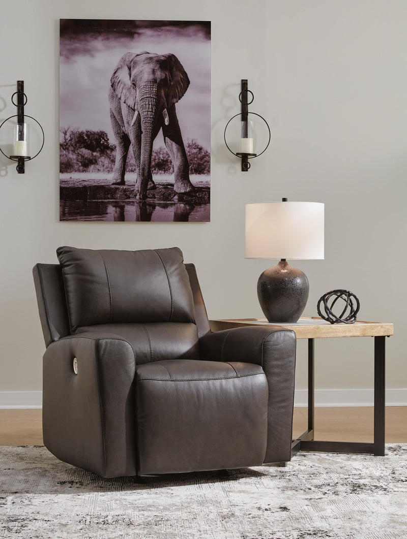 Ashley Furniture Boxmere Power Recliner in dark upholstery, featuring plush cushioning and a modern recline mechanism.