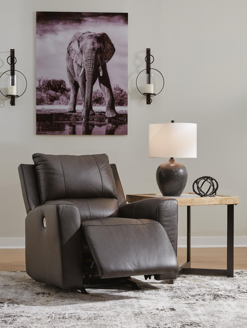 Open Ashley Furniture Boxmere Power Recliner showing plush cushioned seat, armrests, and reclining mechanism in a modern living room setting.