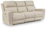 Ashley Furniture Dahlmoore power reclining sofa shown from an angle, featuring plush cushions and a dark fabric upholstery.