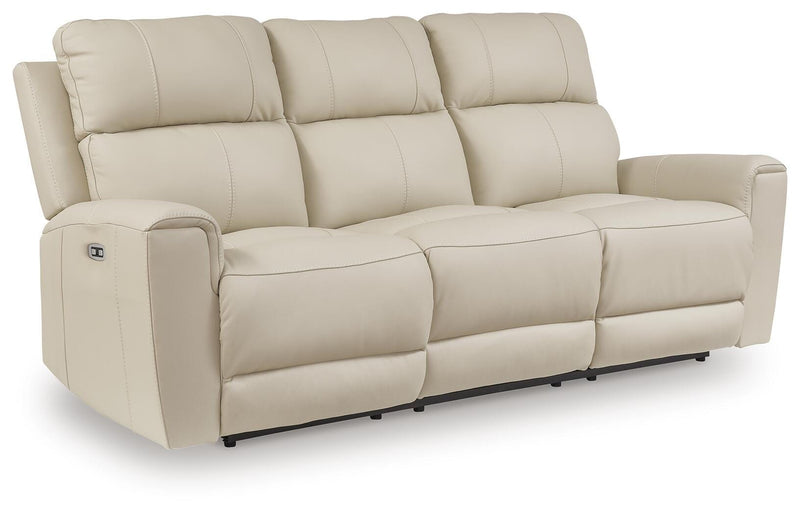 Ashley Furniture Dahlmoore power reclining sofa shown from an angle, featuring plush cushions and a dark fabric upholstery.