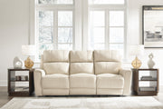 Ashley Furniture Dahlmoore power reclining sofa with plush cushions and dark fabric upholstery, shown in a closed reclined position.