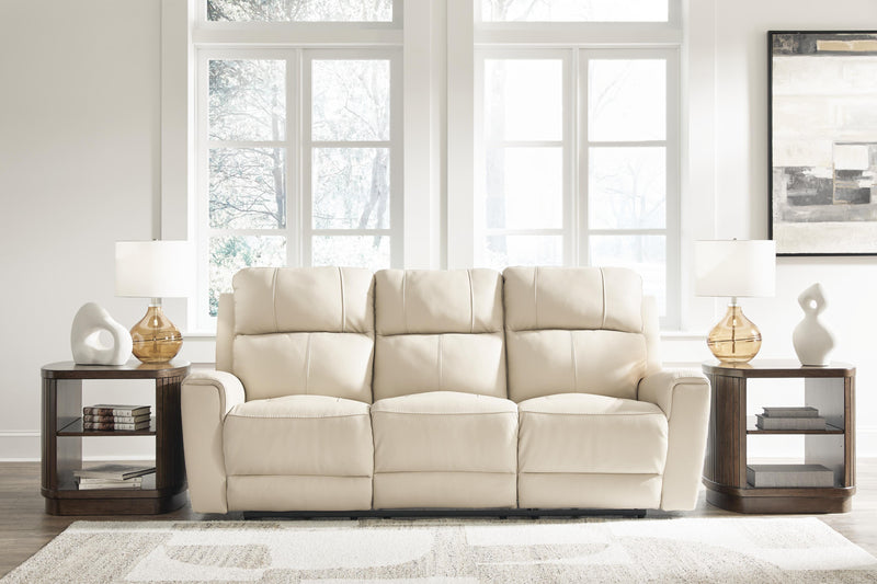 Ashley Furniture Dahlmoore power reclining sofa with plush cushions and dark fabric upholstery, shown in a closed reclined position.