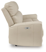 Ashley Furniture Dahlmoore power reclining sofa with plush fabric and padded armrests, shown from a side angle.