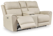 Ashley Furniture Dahlmoore power reclining loveseat with console, shown open from an angle, featuring plush upholstery and built-in cup holders.