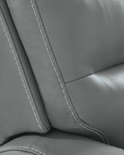 Ashley Furniture Pennacle Pier power recliner with jumbo stitch detailing, featuring plush cushioning and a comfortable reclining design.