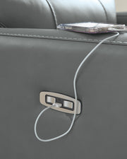 Ashley Furniture Pennacle Pier Power Recliner with USB port, featuring plush cushioning and dark leather upholstery.