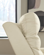 Ashley Furniture Pennacle Pier power recliner with adjustable headrest and plush upholstery, shown in a cozy living room setting.