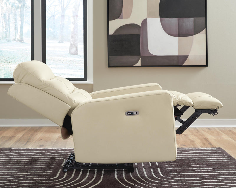 Ashley Furniture Pennacle Pier power recliner in a relaxed lying position, showcasing plush upholstery and modern design.