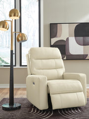 Open Ashley Furniture Pennacle Pier Power Recliner showing plush fabric, padded armrests, and reclining mechanism in a cozy living room setting.