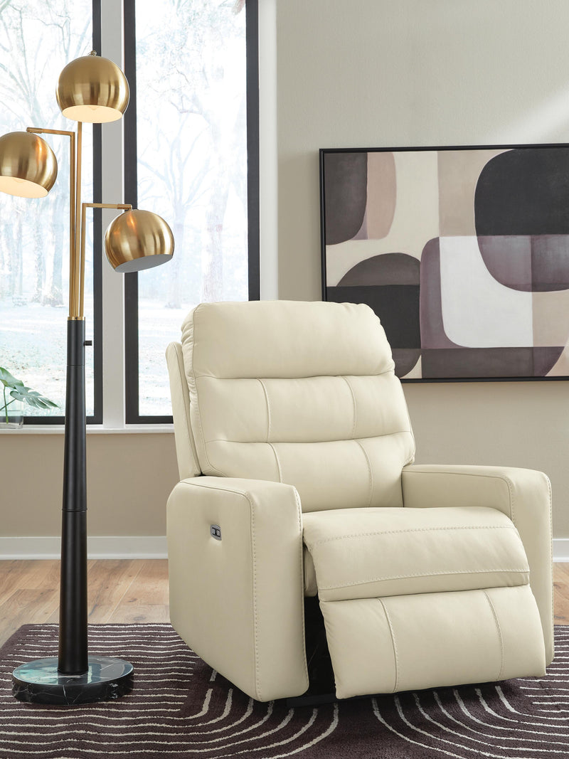 Open Ashley Furniture Pennacle Pier Power Recliner showing plush fabric, padded armrests, and reclining mechanism in a cozy living room setting.