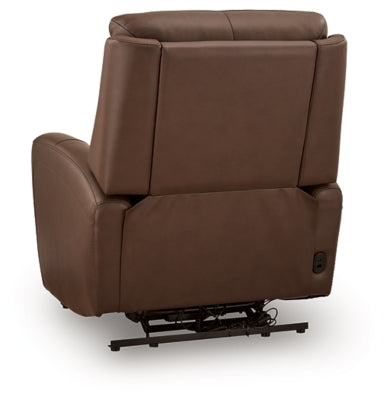 Ashley Furniture Pincara Power AutoGlide Recliner with plush fabric and padded armrests, shown from the back in a modern living room setting.