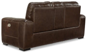 Ashley Furniture Alessandro power reclining loveseat with console, showing plush fabric and built-in cup holders in a cozy living room setting.