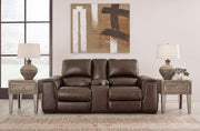 Ashley Furniture Alessandro power reclining loveseat with console, featuring plush upholstery and built-in cup holders.