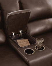 Close-up of the Alessandro power reclining loveseat with console from Ashley Furniture, showing plush upholstery and built-in cupholders