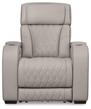 Boyington Power Recliner by Ashley Furniture, close-up of the brown upholstered recliner with plush cushioning and a built-in footrest.