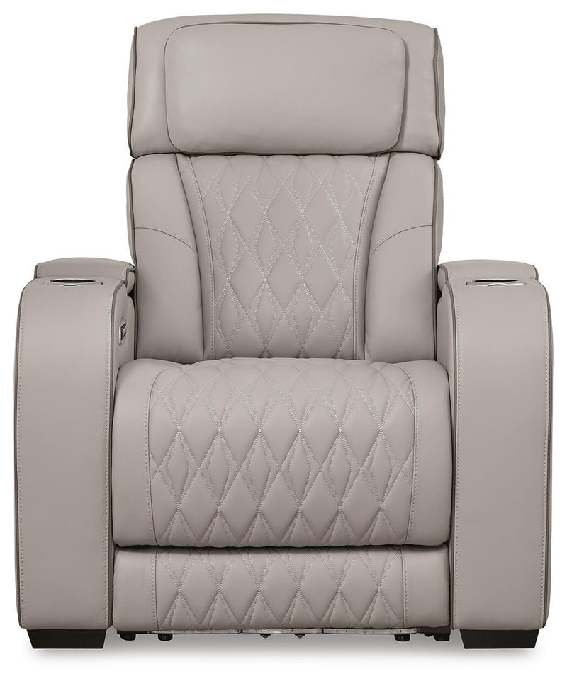 Boyington Power Recliner by Ashley Furniture, close-up of the brown upholstered recliner with plush cushioning and a built-in footrest.