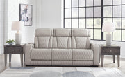 Ashley Furniture Boyington living room set with a plush sofa and matching armchair, featuring neutral upholstery and modern design.