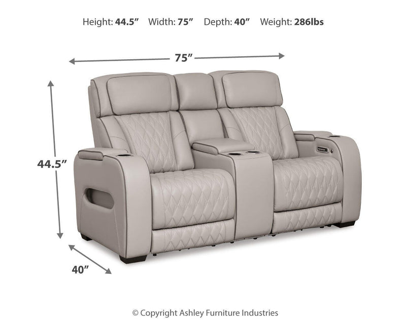 Boyington Power Reclining Loveseat by Ashley Furniture with built-in console, featuring plush cushions and dark upholstery.