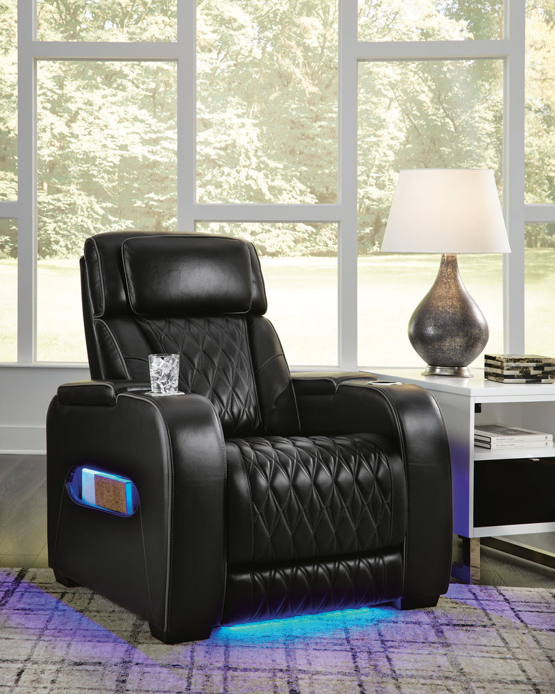 Ashley Furniture Boyington Power Recliner in closed position with plush cushioning and dark upholstery.