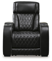 Boyington Power Recliner by Ashley Furniture, close-up view showing the plush fabric upholstery and reclining mechanism.