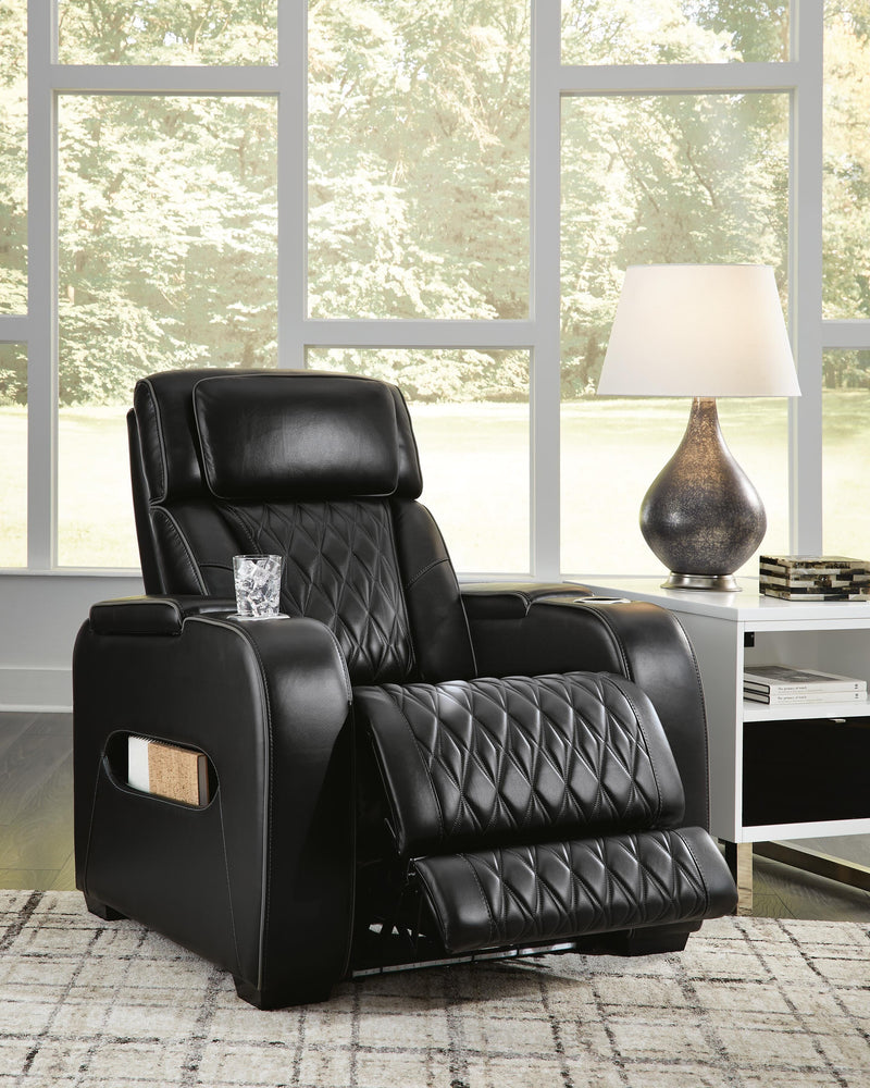 Open Boyington Power Recliner by Ashley Furniture showing plush upholstery, padded armrests, and reclining mechanism.