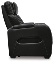 Boyington Power Recliner by Ashley Furniture, showing a close-up of the dark leather armrest and reclining mechanism.