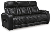 Ashley Furniture Boyington power reclining sofa shown from an angled view, featuring plush cushions and a dark leather finish.