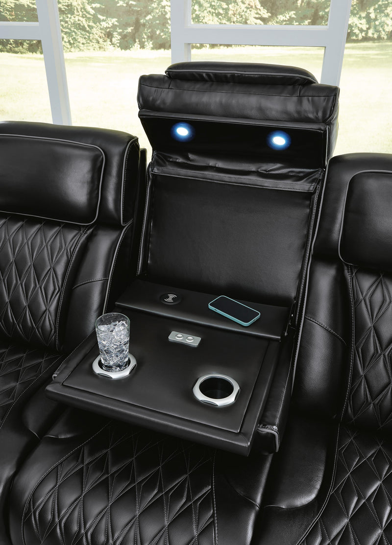 Ashley Furniture Boyington Power Reclining Sofa with plush fabric and padded armrests, showing detailed close-up of the reclining mechanism.