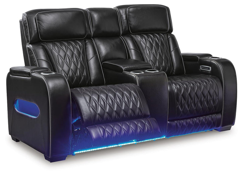 Ashley Furniture Boyington power reclining loveseat with console, shown open with plush cushions and built-in cup holders.
