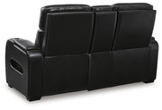 Ashley Furniture Boyington power reclining loveseat with console, showing plush fabric, reclining mechanism, and built-in cup holders.