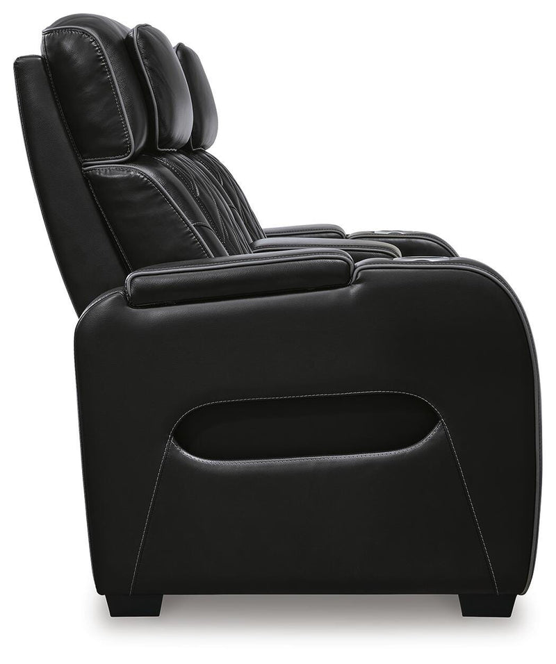 Boyington Power Reclining Loveseat with Console by Ashley Furniture, showing plush fabric, reclining mechanism, and built-in console.