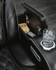 Boyington Power Recliner by Ashley Furniture showing close-up of armrest and textured fabric in a modern recliner design