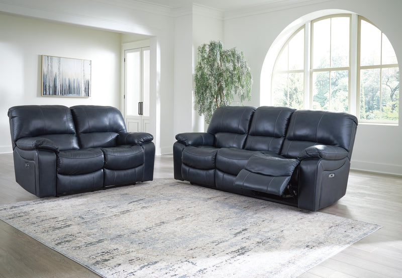 Ashley Furniture Leesworth living room set with sofa and loveseat, upholstered in neutral fabric, in a modern living space.