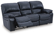 Ashley Furniture Leesworth living room set with a sectional sofa and matching ottoman, shown from an angled open view.