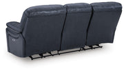Ashley Furniture Leesworth living room set featuring plush sofas and armchairs in neutral fabric, shown from the back.
