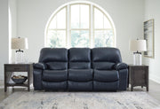 Ashley Furniture Leesworth living room set with plush sofa and matching loveseat, fabric upholstery, and decorative throw pillows.
