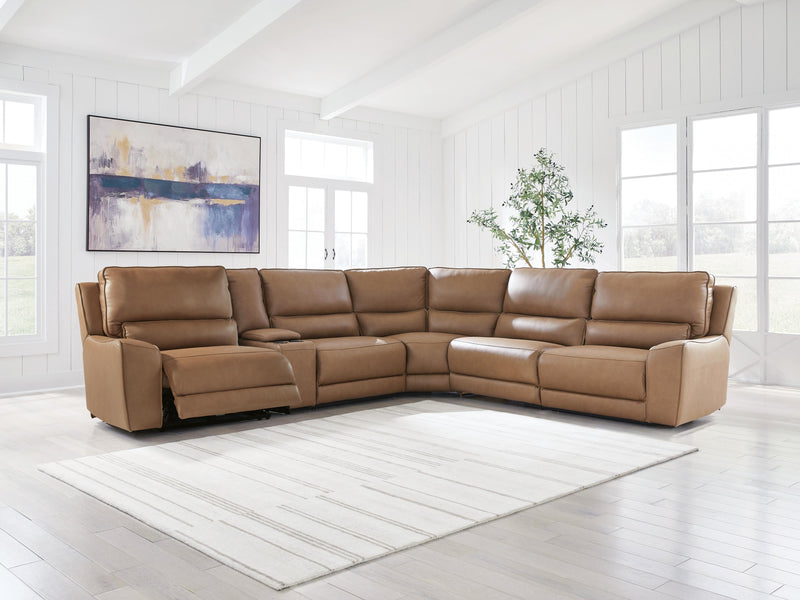 Ashley Furniture DeepWakes reclining sectional with storage console, shown in a modern fabric with plush cushions and built-in cup holders.