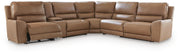 Ashley Furniture DeepWakes reclining sectional with storage console, showing plush cushions and open storage in a modern living room setting