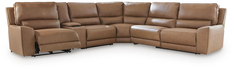 Ashley Furniture DeepWakes reclining sectional with storage console, showing plush cushions and open storage in a modern living room setting
