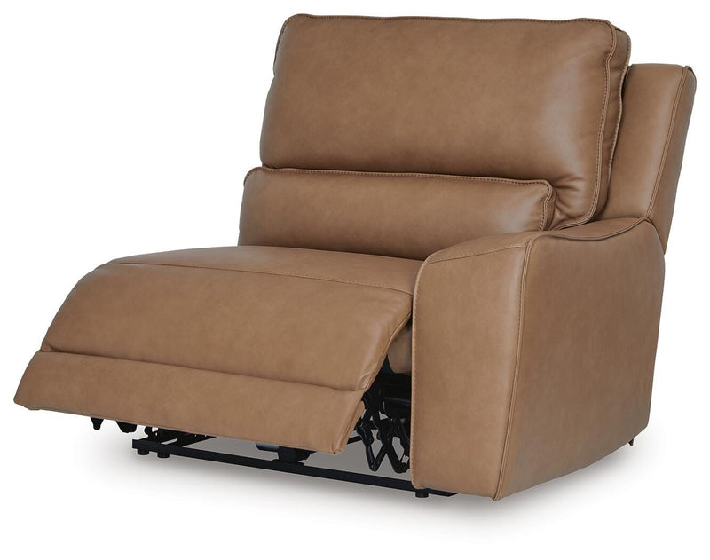 Ashley Furniture DeepWakes reclining sectional with storage console, shown from an angled open view, featuring plush cushions and modern design.