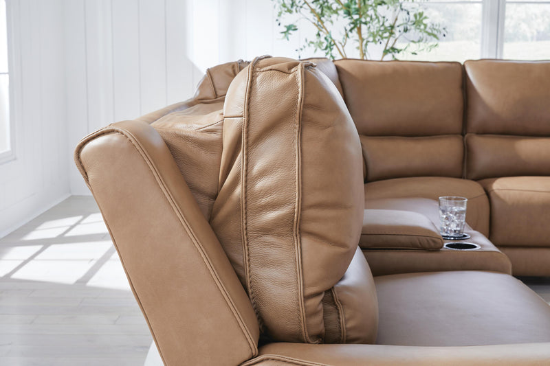 Ashley Furniture DeepWakes reclining sectional with storage console, showing plush cushions and modern design in a cozy living room.