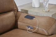 Ashley Furniture DeepWakes sectional reclining sofa chaise with power USB ports, featuring plush upholstery and modern design.