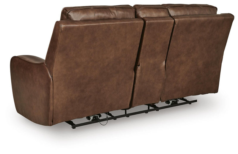 DeepWakes reclining living room set by Ashley Furniture, showing a plush sofa with reclining seats and overstuffed cushions.