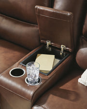 Ashley Furniture DeepWakes reclining living room set with a console table, featuring plush cushions and modern design.