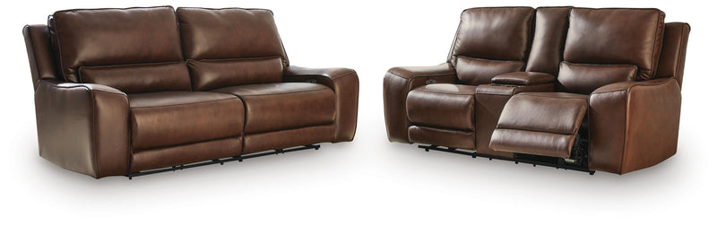 Ashley Furniture DeepWakes reclining living room set with plush cushions and dark upholstery, shown from a front view.