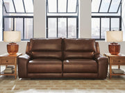 DeepWakes Ashley Furniture reclining living room set with plush cushions and dark upholstery, shown in a cozy modern living space.