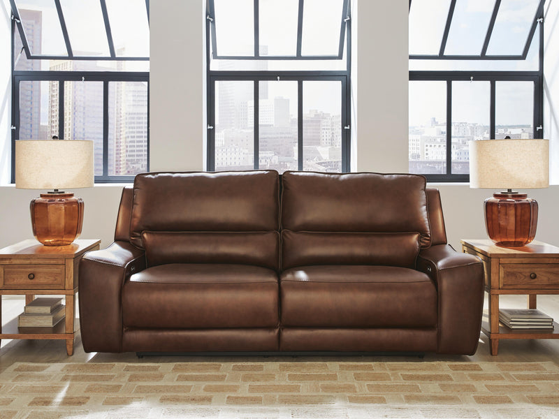DeepWakes Ashley Furniture reclining living room set with plush cushions and dark upholstery, shown in a cozy modern living space.